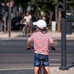 cyclists riding in a protected bike lane